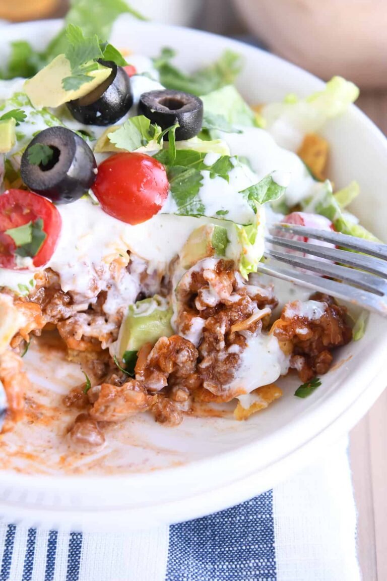 These floating taco bowls hold all the goodness of tacos layered in a bowl and smothered with creamy lime dressing and tons of toppings! The flavorful meat and rice filling is so delicious!