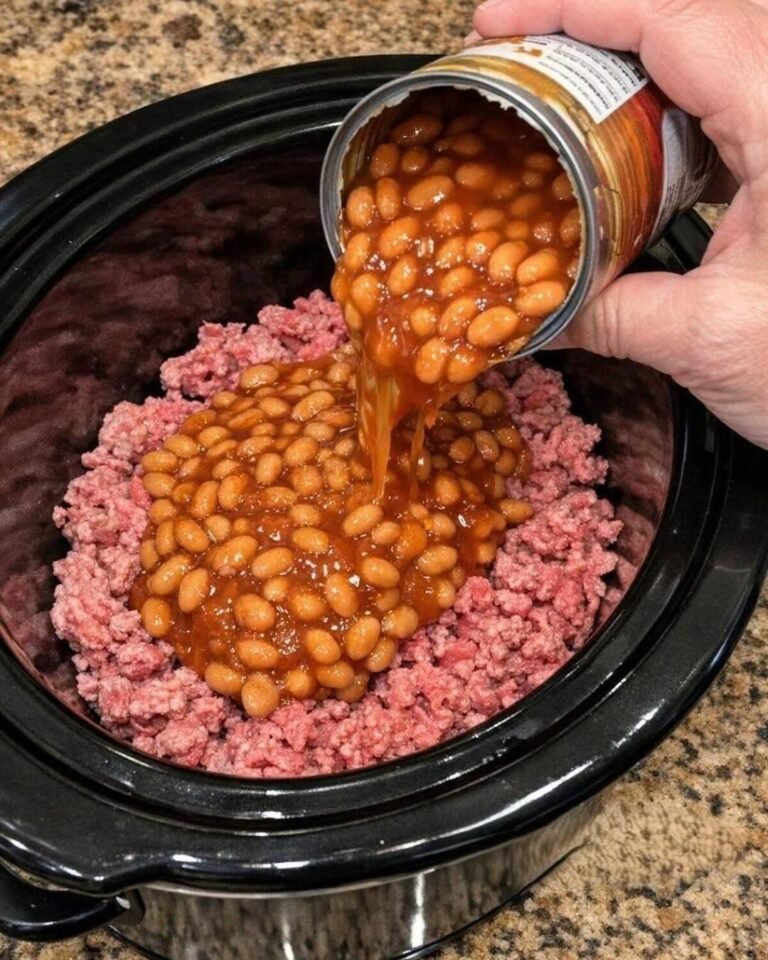 Pour canned baked beans over raw ground beef, together with 3 ingredients, into slow cooker for a comforting supper that’s always a yes in my house